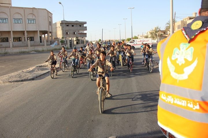 Waddan Scout, an oasis town in southern Libya, holds a peace bike. Tuesday, July 07, 2015. Photos: Waddan Scout